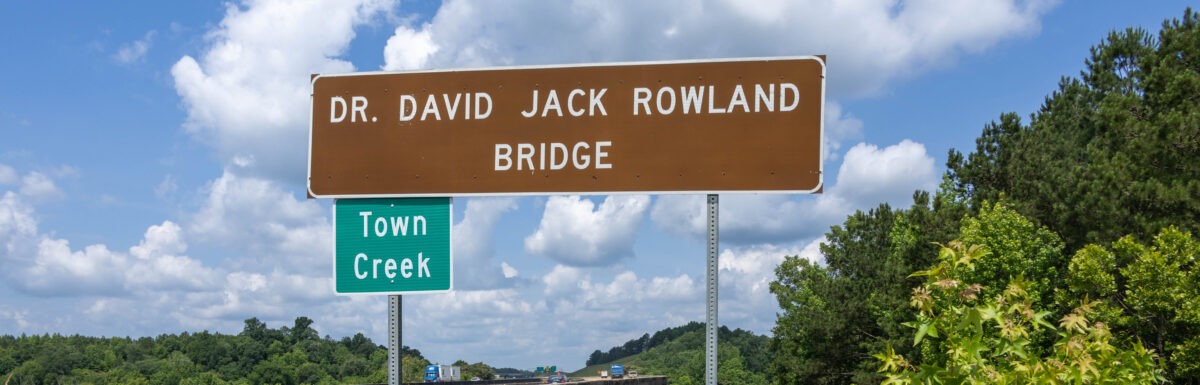 Town Creek sign off the interstate on Dr. David Jack Rowland Bridge