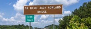 Town Creek sign off the interstate on Dr. David Jack Rowland Bridge
