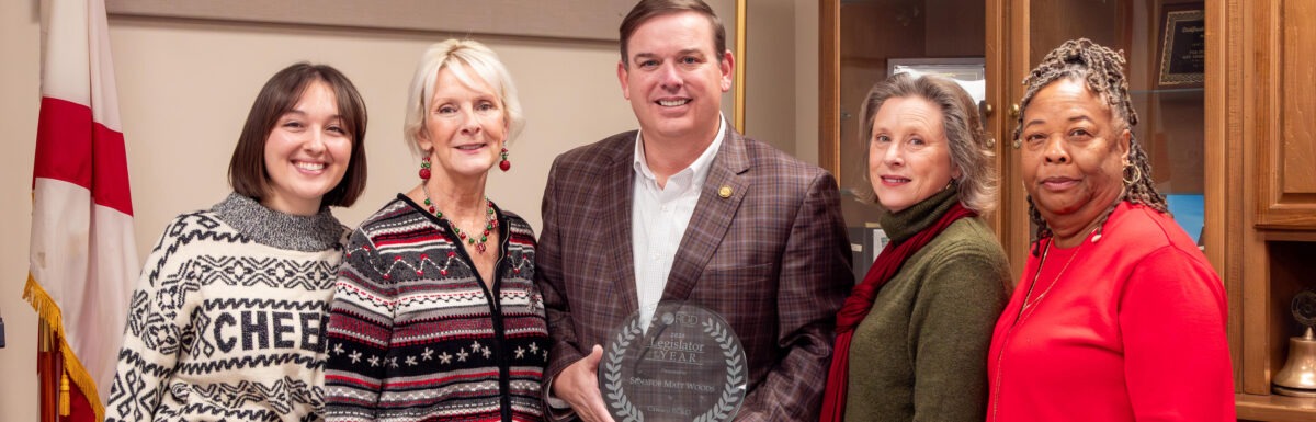Sen. Matt Woods accepts the Legislator of the Year Award, pictured with Erin Hackenmueller, Patti Pennington, Kellie Johnston, & Sheila Baker