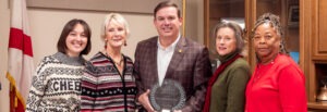Sen. Matt Woods accepts the Legislator of the Year Award, pictured with Erin Hackenmueller, Patti Pennington, Kellie Johnston, & Sheila Baker