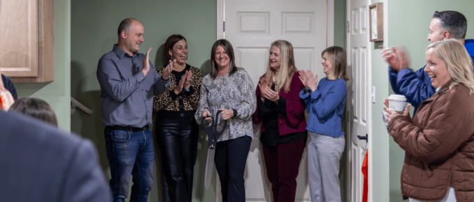 RPP Executive Director and board smile and applaud immediately after ED cut the ribbon, officially opening the facility